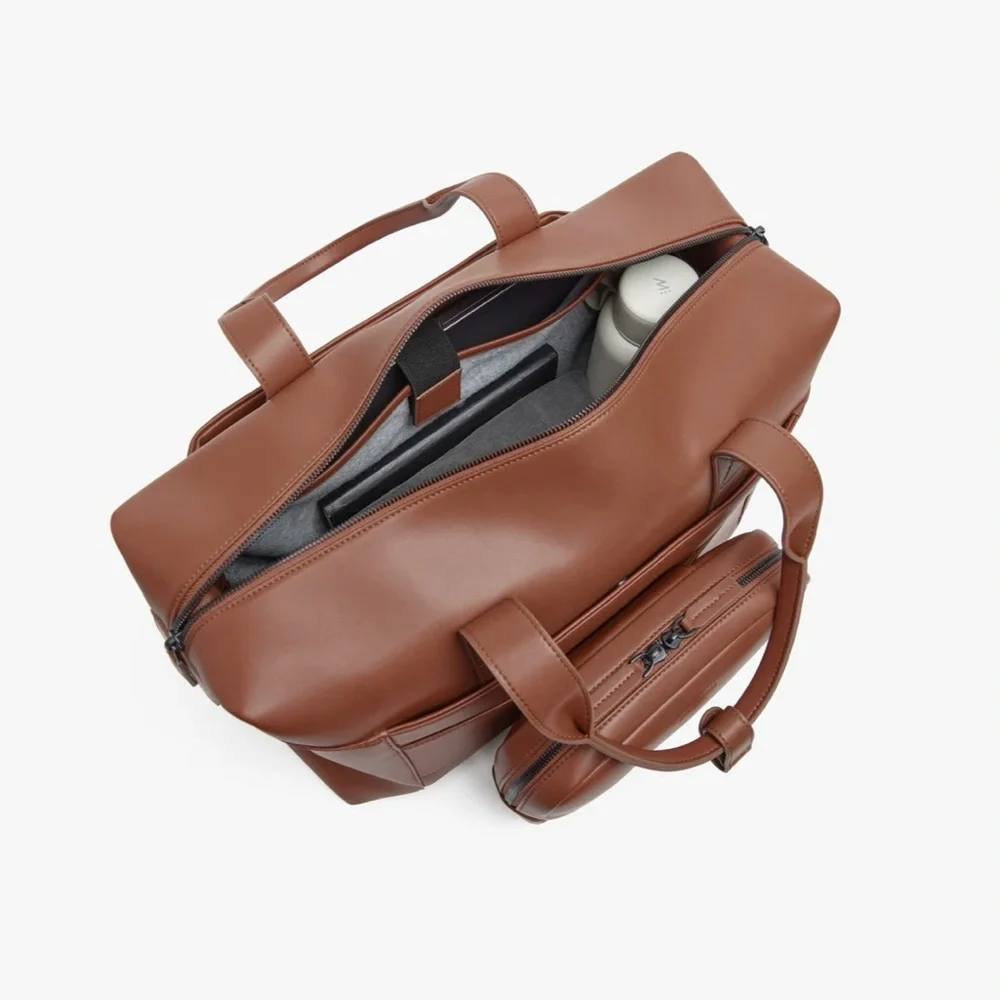 NWOT Monos Metro Duffel in color Mahogany
